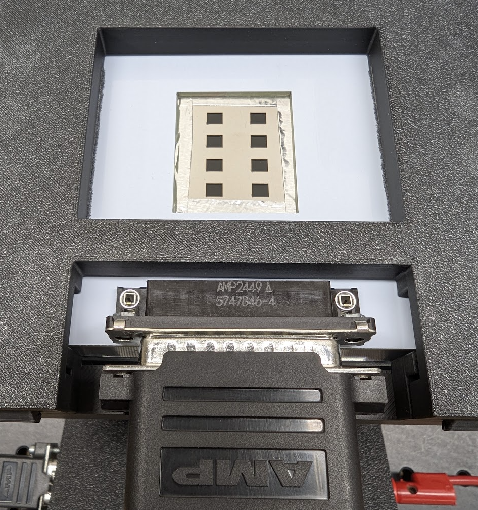Solar cell placed in the EQE alignment jig with the pixel mask visible from above
