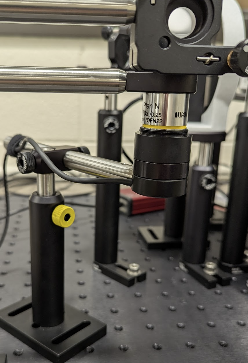Photodiode power sensor positioned under the microscope objective for the power measurement