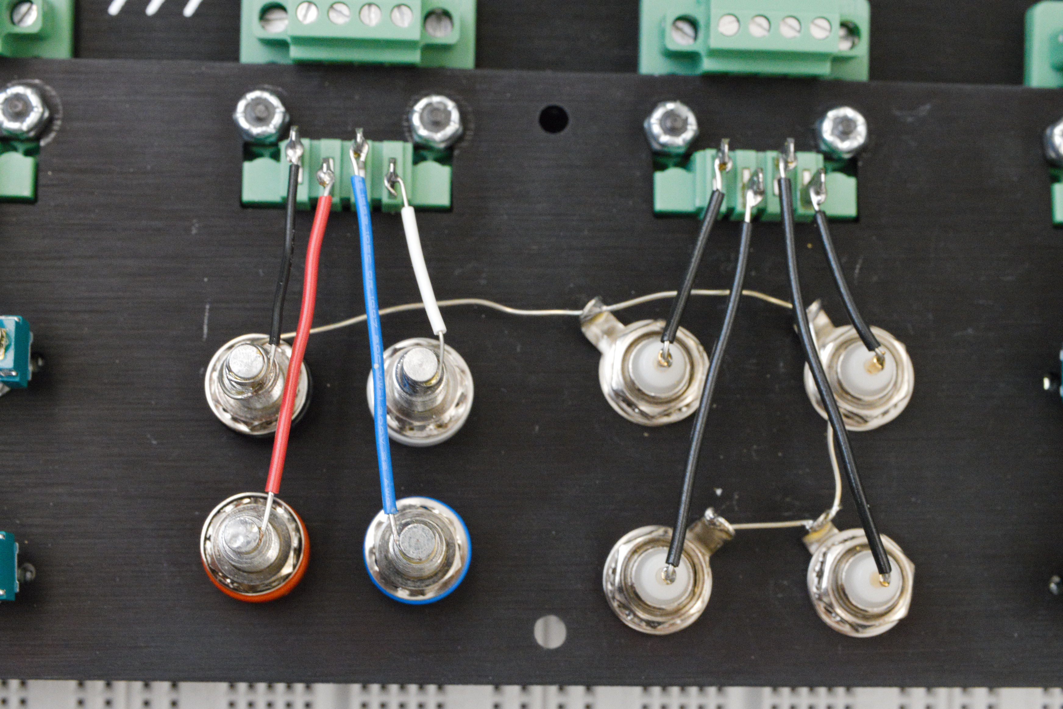 The outer conductor of the BNC connectors are all connected to the black banana port.