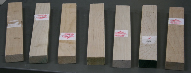 Seven wood blocks each just under a foot long and as thick as a thumbtip.