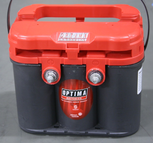 Six liter-size cells in a plastic case with exposed terminals on the front.