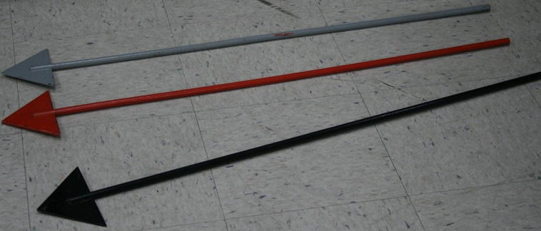 Three meter-long arrows, one each black, gray, and red.