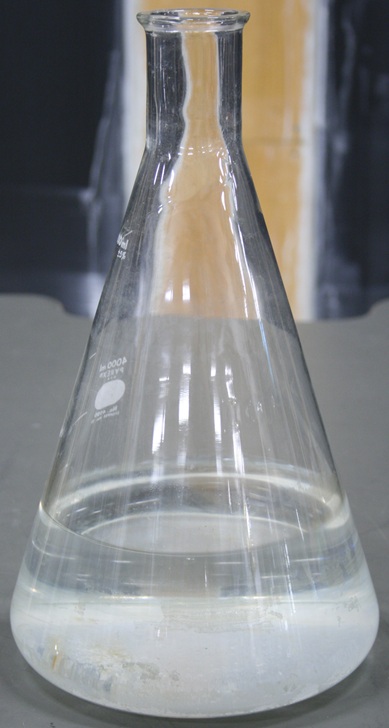 Large glass flask tapering to a narrow mouth, marked in 500 ml increments from 1000 to 4000 with 5 percent tolerance.