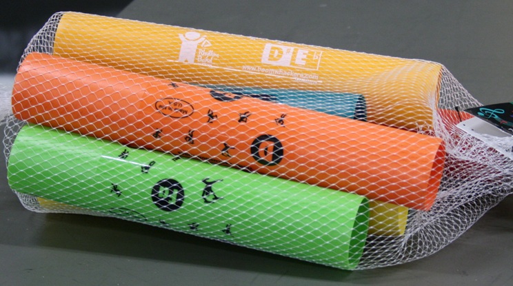 Mesh bag of hollow plastic tubes.