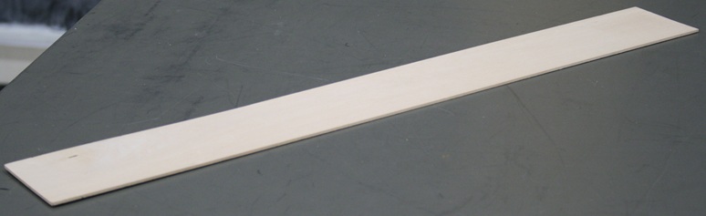 A thin strip of basswood two feet long and three inches wide.
