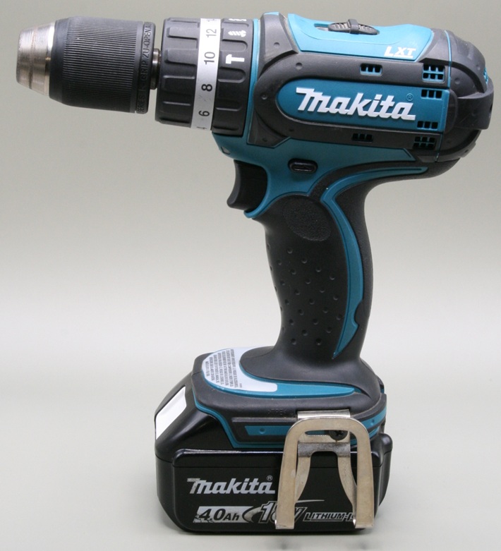 A Makita handheld electric drill with a battery pack.