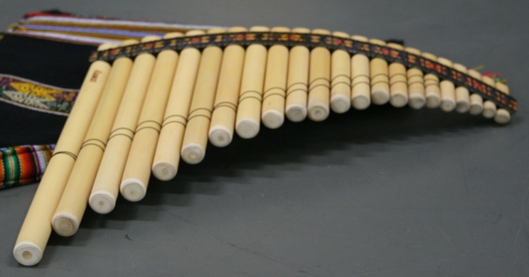 A set of 22 tuned bamboo pipes, including chromatic notes, comprising a scale and a half.