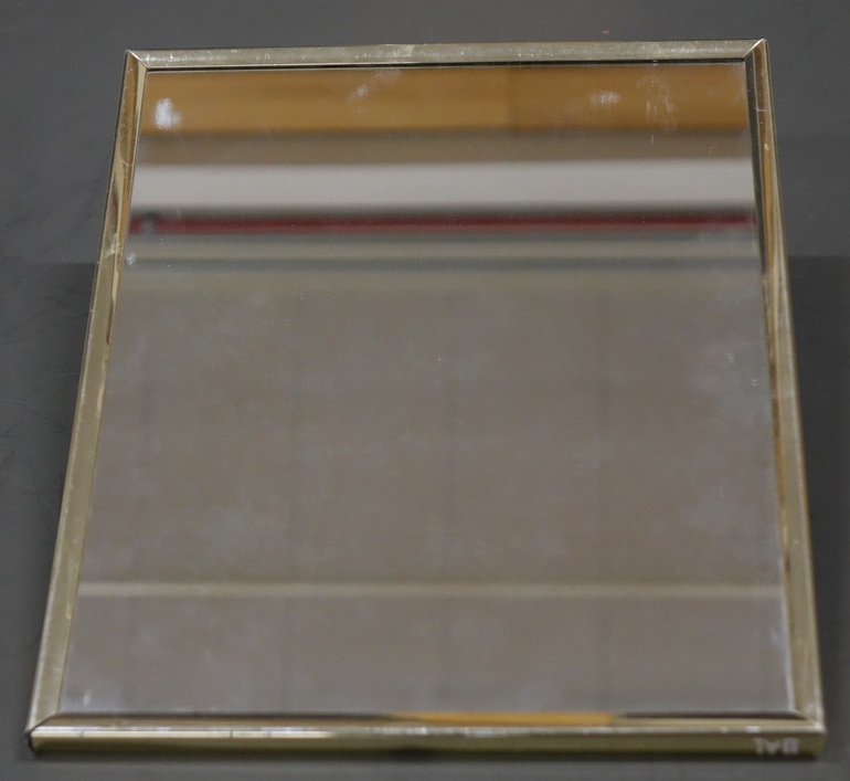 An 11 by 14 inch mirror with a narrow plastic frame.