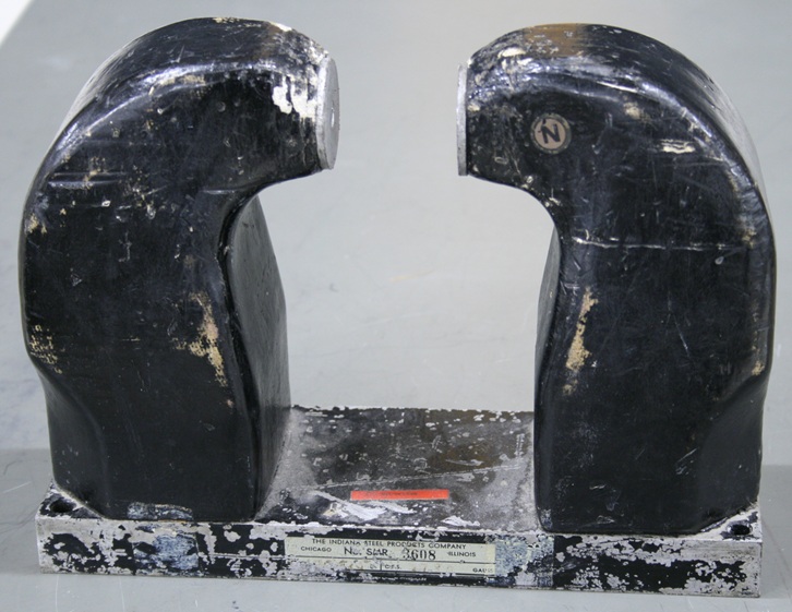Two 8-inch tall, 3-inch thick magnetic poles mounted on a strong iron base make up a powerful horseshoe magnet with 2 inches separation between the poles.