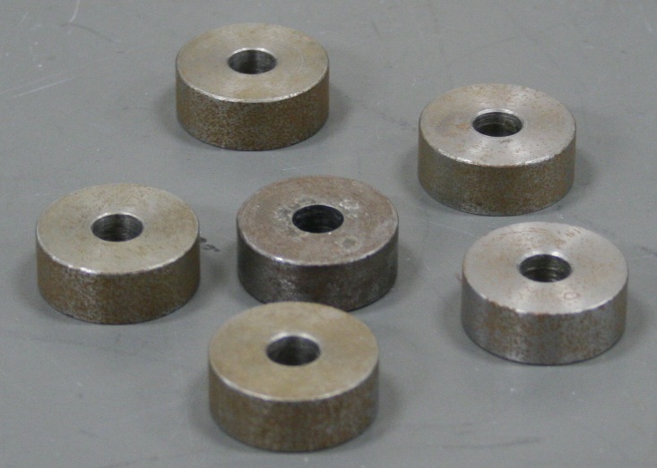 Six ring-shaped masses, 3/8 outer diameter one inch, inner diameter 5/16 of an inch.