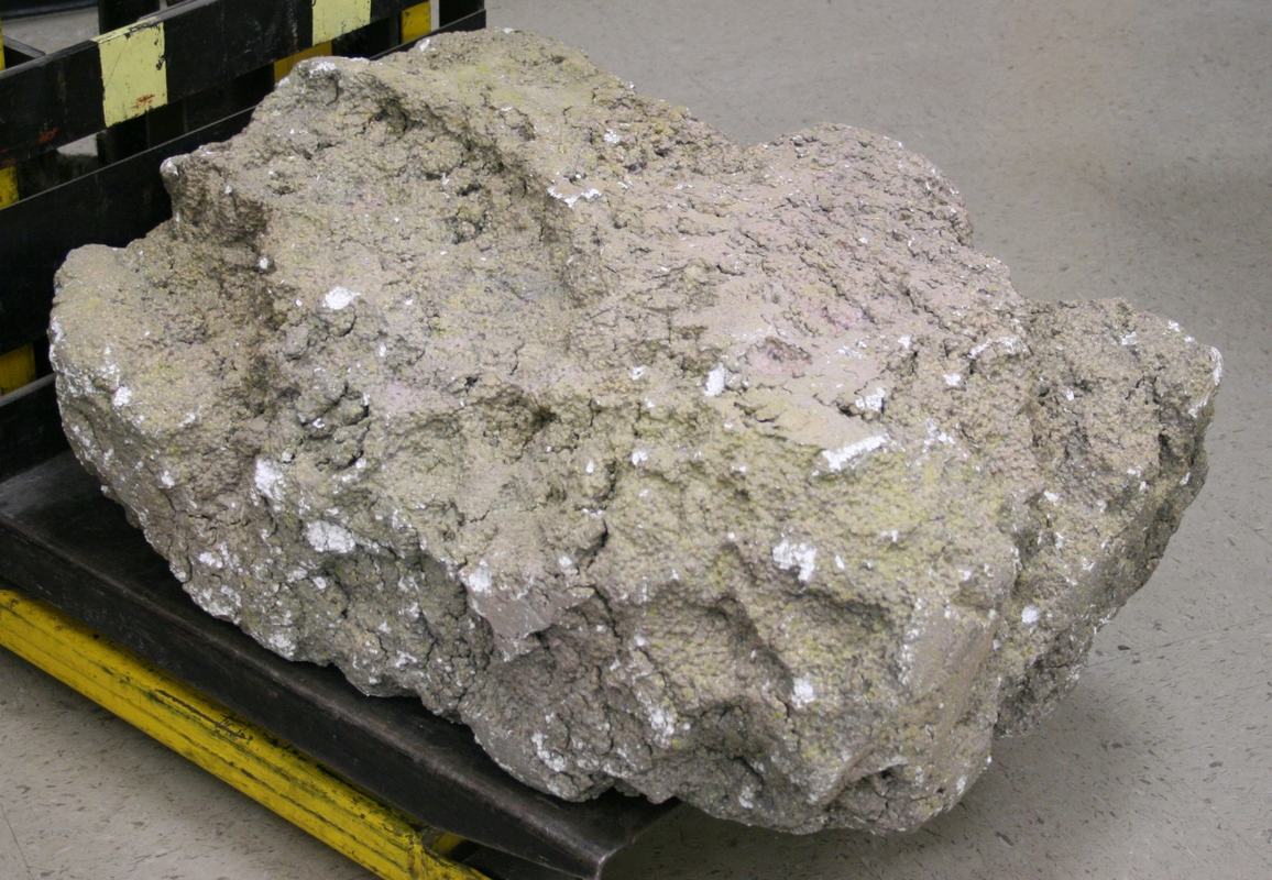 Close-up of the styrofoam boulder showing convincingly realistic rough, porous rock texture with varied coloration