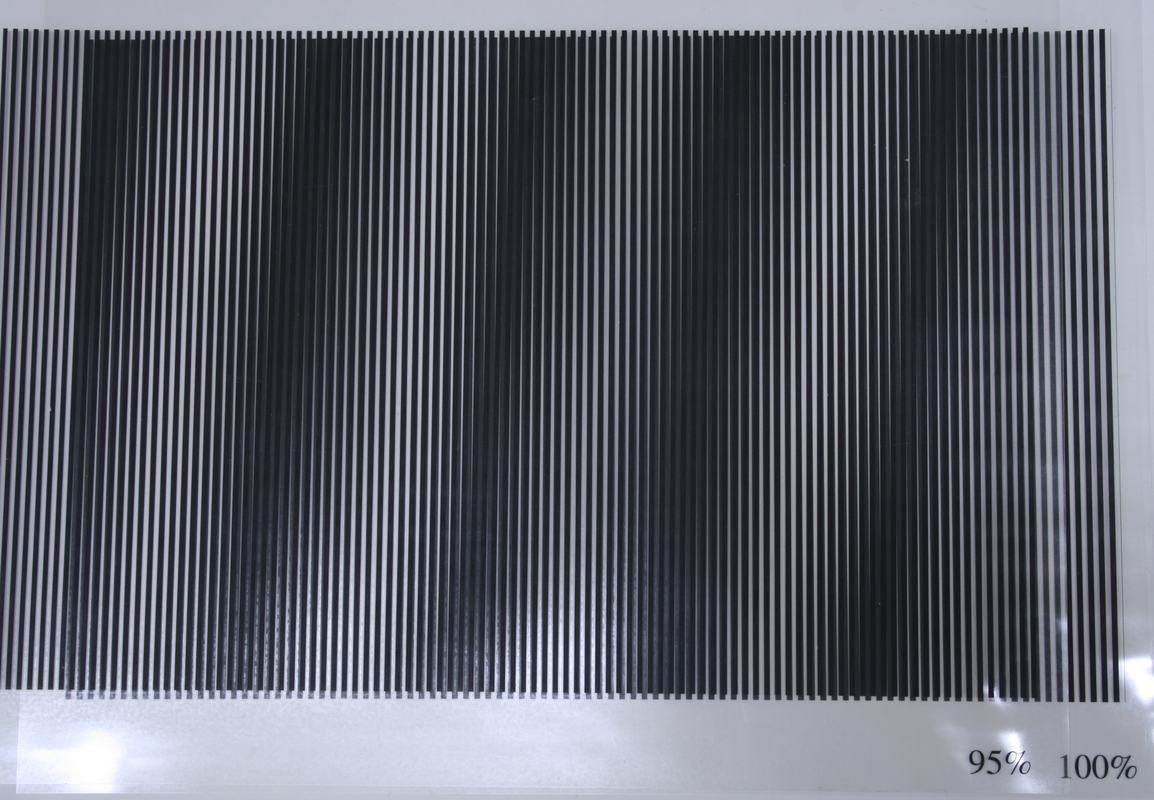 Two overlapping transparency sheets at 95% and 100% line density, showing clear vertical beat bands
