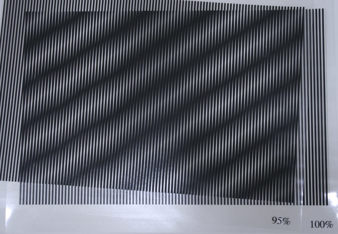 95% and 100% transparency sheets with one slightly rotated, producing dramatic diagonal moire bands