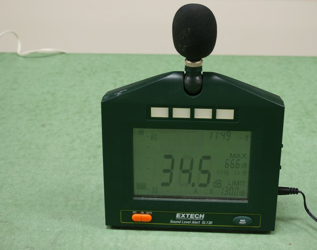 Same Extech SL130 meter in a quiet room reading 34.5 dB, showing background electronic hum level