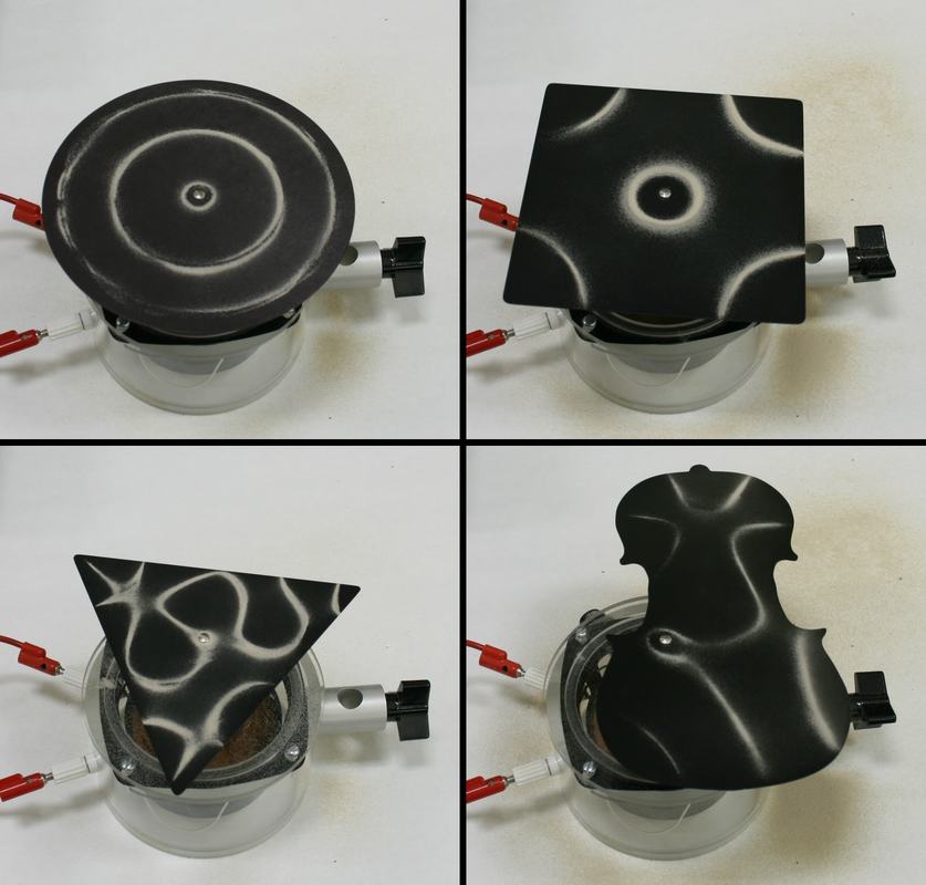 Four Chladni plates of different shapes — circular, square, triangular, and violin-shaped — each mounted on a clear cylindrical audio driver, showing sand patterns at resonant frequencies