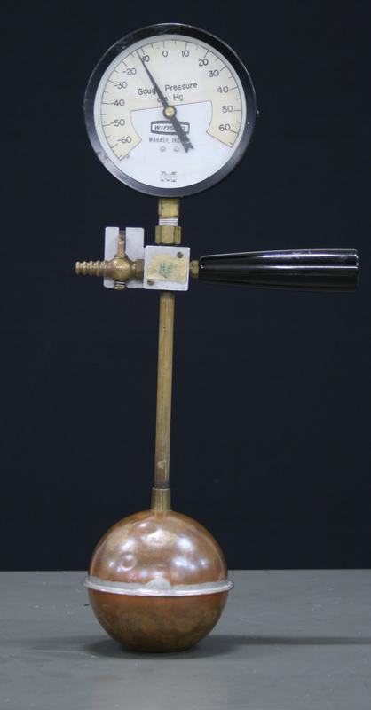 Gas thermometer with copper spherical bulb, brass stem, Winsco gauge reading -60 to 60 cm Hg, brass valve with hose barb, and black handle