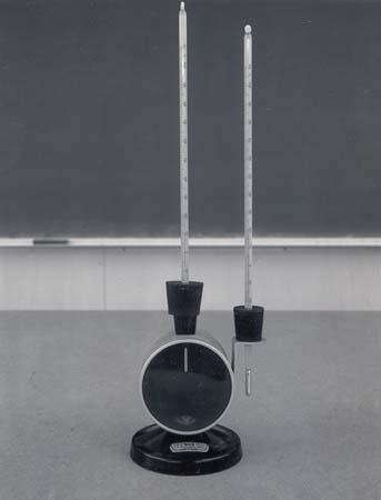 Absorption cell — a dark cylindrical cell on a stand with two mercury thermometers, one inserted through the cell and one mounted externally
