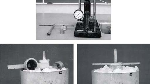 Three views of the ice fountain apparatus: top shows the hydraulic jack with pressure gauge, central cylinder, and conical nozzle on a demo bench with tools; bottom-left shows the outer cylinder filled with crushed ice and the nozzle visible at top; bottom-right shows an extruded ice cylinder emerging from the nozzle