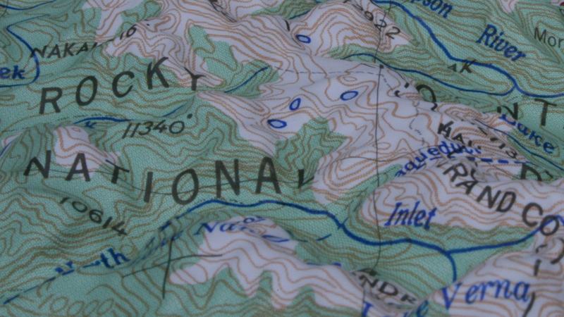 Raised-relief topographic map of Rocky Mountain National Park showing contour lines, peaks, valleys, and labeled features including Lake Verna and Inlet