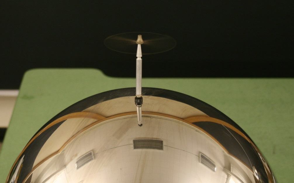 Electric whirl spinning on the Van de Graaff dome, with motion blur visible from rapid rotation