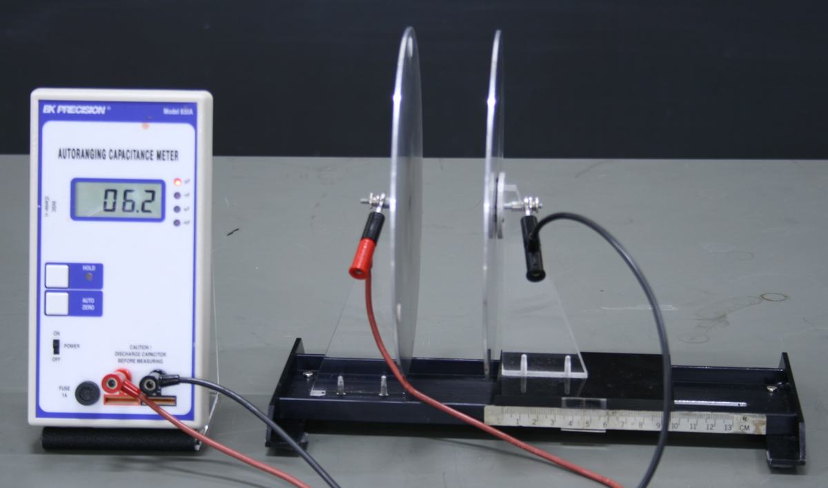Capacitance meter reading 06.2 pF with plates moved slightly closer together