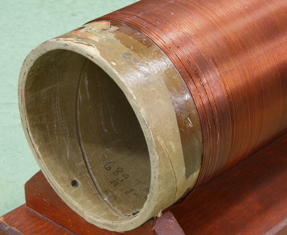 End view of the solenoid showing the hollow cardboard core and tightly wound copper wire