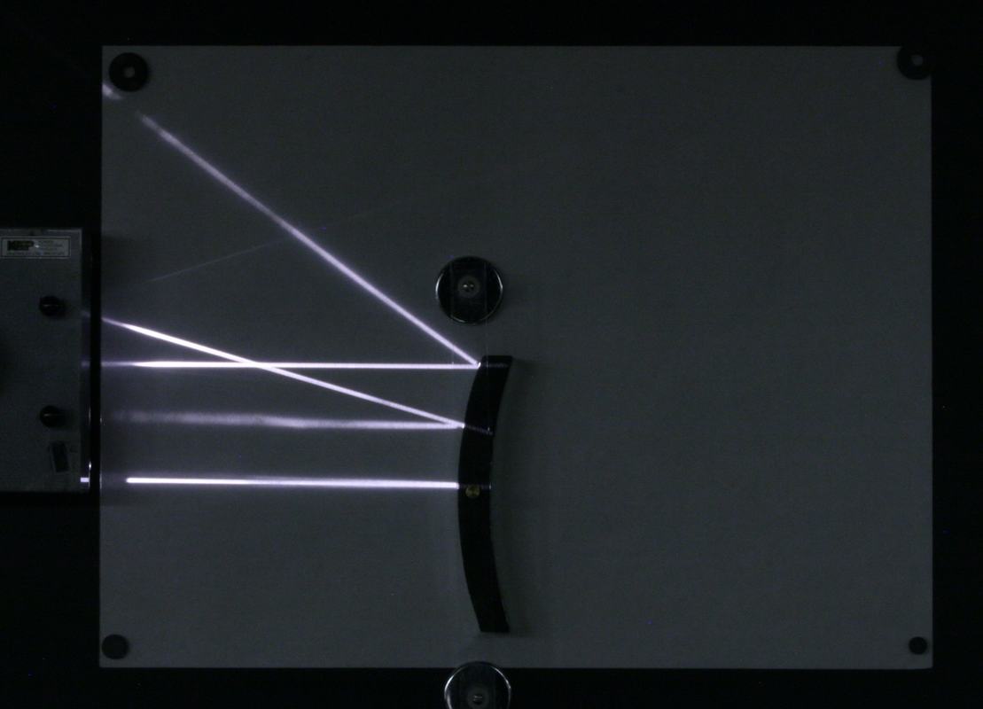 Three parallel rays reflect from a convex mirror surface and diverge, spreading apart after reflection