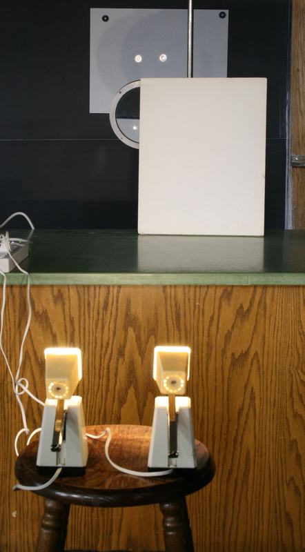 Same setup with a piece of white cardboard blocking approximately half the convex lens aperture