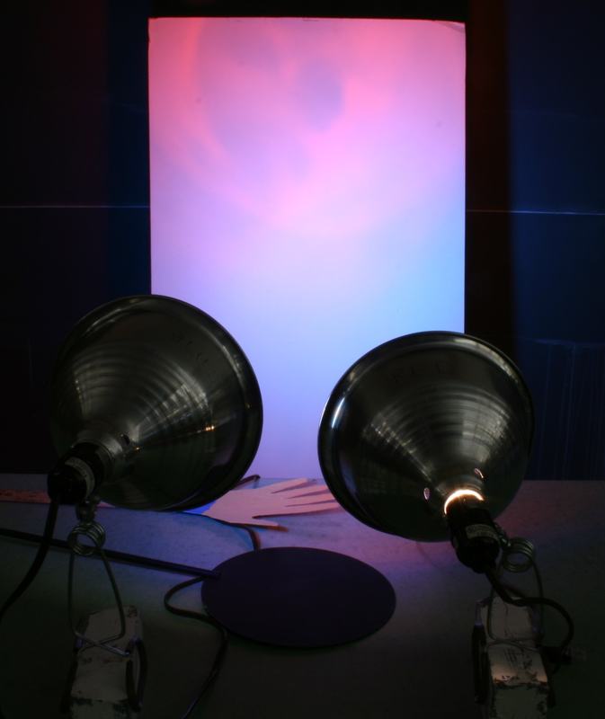 Screen showing pink/magenta where blue and red light overlap, with blue and red regions at the edges