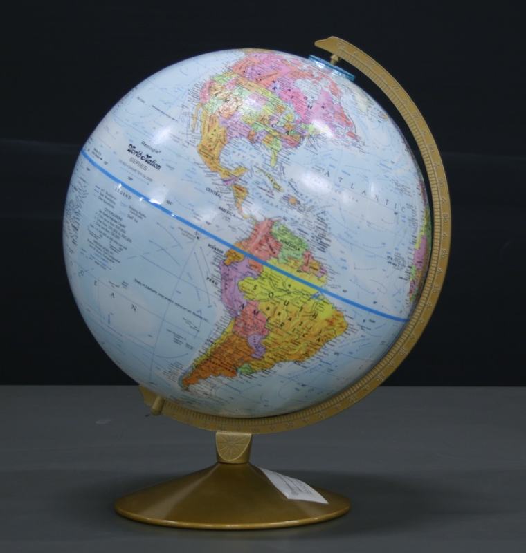Political globe on gold stand with half-meridian ring, showing Americas