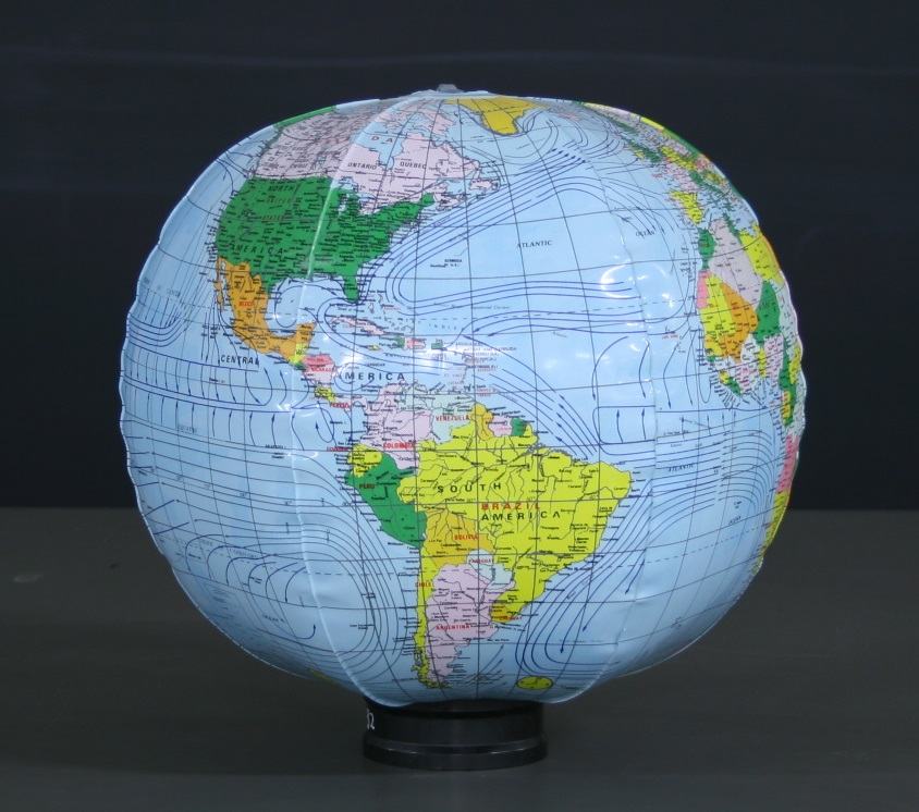 Inflatable political globe with ocean current lines showing Americas and Atlantic